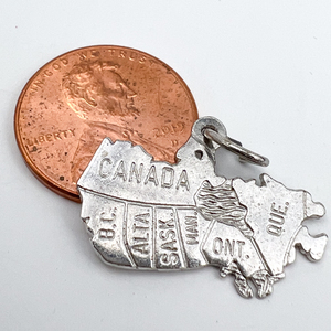 lot 133 image: Canada with provinces outlined , Rembrandt Awards Sterling Silver Charm.