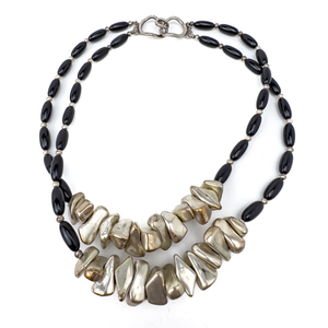 lot 207 image: Pebble and black, Unknown Maker, White Base Metal Double-Strand Bead Necklace.
