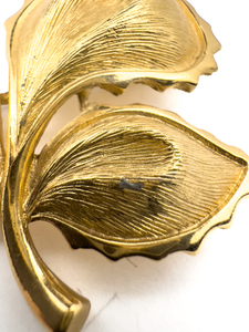 lot 197 image: Monet, Three leaves Yellow Base Metal Brooch.