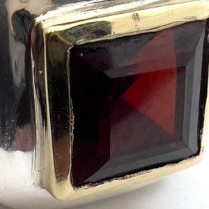 lot 243 image: Unknown Maker, Bezel Set Garnet Sterling Silver And 14K Gold Ring, Set With Garnet. Size 7 - 7.25.
