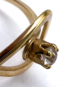 lot 235 image: AVON CZ With Loop Yellow Base Metal Ring. Size 6 - 8.