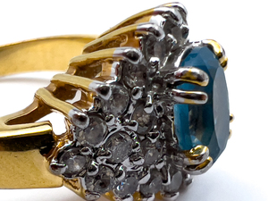 lot 237 image: Unknown Maker, Swiss Blue Topaz And CZ Yellow Base Metal Ring. Size 8 - 8.25.