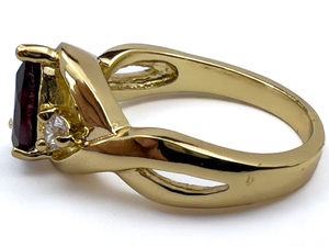 lot 241 image: Garnet And CZ Yellow Base Metal Ring. Size 7.75 - 8.