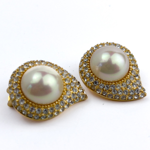 lot 216 image: Christian Dior, Yellow Plated Metal Clip-On Earrings. FlameStylized Drop Motif.