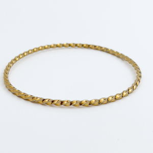 lot 174 image: Twisted, Unknown Maker, Yellow Plated Base Metal Slip-On Bangle Bracelet.