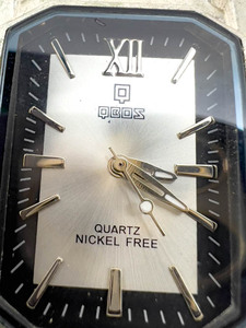 lot 106 image: Mens QBOS sliverblack dial white stainless steel and base metal Quartz Analog watch. Working