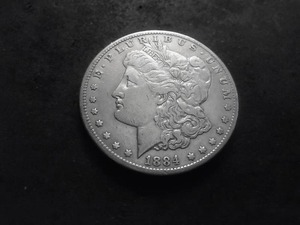lot 10 image: 1884 CC Morgan Silver Dollar