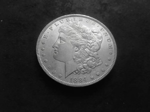lot 11 image: 1884 O Morgan Silver Dollar