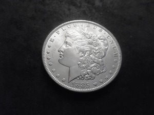 lot 13 image: 1885 O Morgan Silver Dollar
