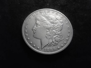 lot 17 image: 1886 O Morgan Silver Dollar