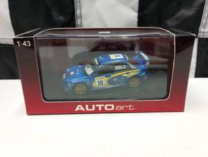lot 251 image: Autoart Subaru Impreza WRC 143rd Scale Die Cast Car