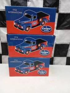 lot 284 image: Cooper Tires 1954 International Trucks Die Cast Coin Banks