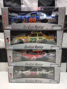 lot 475 image: Team Caliber Pit Stop 124th Scale Die Cast Cars