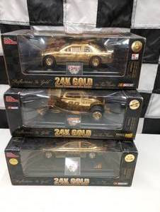 lot 574 image: Racing Champion Reflections In Gold 24K Gold Plated Commemorative Series 124th Scale Die Cast Cars