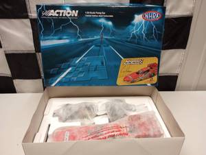 lot 695 image: Action NHRA Cruz Pedregon #10 Advance Auto Parts 124th Scale Die Cast Funny Car