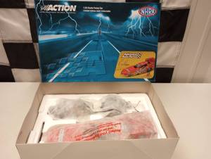 lot 696 image: Action NHRA Cruz Pedregon #10 Advance Auto Parts 124th Scale Die Cast Funny Car