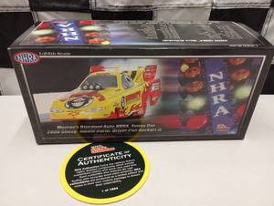 lot 698 image: Racing Champion NHRA Phil Burkart Jr. Murrays Discount Auto 124th Scale Die Cast Funny Car
