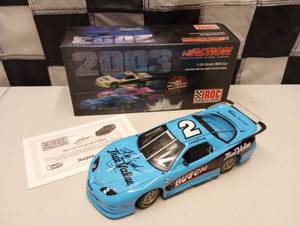 lot 823 image: Autographed Kyle Bush 124 Die Cast Car Iroc Talladega Win