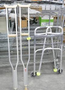 lot 13 image: Pair of crutches and folding Walker that is like new
