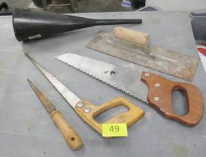 lot 49 image: Misc saws, funnel, cement trowel