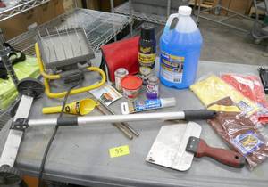 lot 55 image: Box of garage stuff, magnet on wheels, microfiber cloth, windshield washer fluid