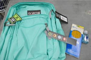 lot 78 image: Teal colored backpack and pack of pencils