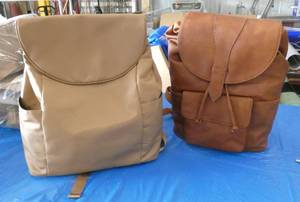 lot 97 image: Two new travel backpack purses