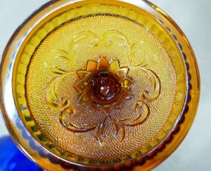 lot 201 image: Pair of vintage amber glass candle holders and a dark blue dish