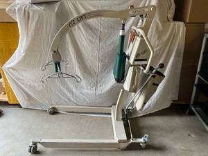 lot 24 image: MSRP $6500 MCKESSON EZ WAY Easy Way Battery Powered Electric EZ Lift 500lb Capacity Patient Loved One Transfer From The Ground Or Chair Lift With BATTERY &amp&nbspSLING (Not Pictured)- GREAT WORKING CONDITION No Charger Can Be Purchased Online