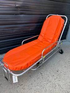 lot 45 image: MSRP $6000 Ferno Patient Emergency Transport Stretcher&nbspMobile Transporter X-Frame Ambulance Cot - Good Working Condition - Mattress Has Wear &amp Tear&nbsp Excellent For Halloween Prop