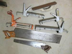 lot 65 image: Caulking guns and handsaws