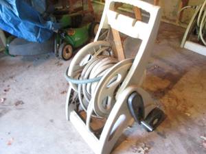 lot 211 image: Suncast hose reel with garden hose