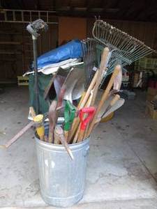 lot 226 image: Metal trash can full of shovels, etc