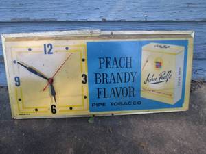 lot 235 image: Tobacco advertisement light-up wall clock