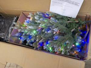 lot 29 image: 4.5 ft Artificial Potted Pre-Lit As...