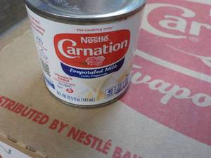 lot 129 image: 24 ct 5 oz Cans Nestles Carnation E...