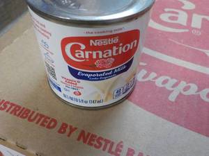 lot 130 image: 24 ct 5 oz Cans Nestles Carnation E...