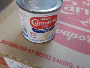 lot 131 image: 24 ct 5 oz Cans Nestles Carnation E...