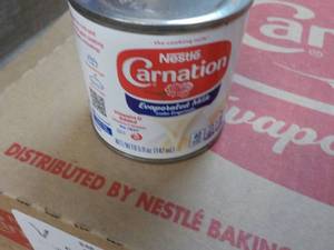 lot 132 image: 24 ct 5 oz Cans Nestles Carnation E...