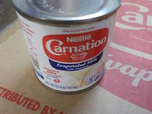 lot 133 image: 24 ct 5 oz Cans Nestles Carnation E...