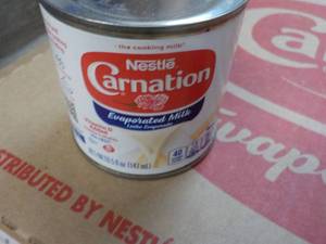 lot 134 image: 24 ct 5 oz Cans Nestles Carnation E...
