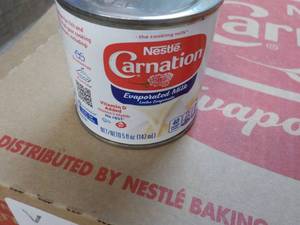 lot 135 image: 24 ct 5 oz Cans Nestles Carnation E...