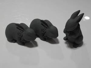 Three Cement Rabbit Statues