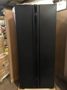Husky Heavy Duty Welded 20-Gauge Steel Freestanding Garage Cabinet in Black (36 in. W x 81 in. H x 24 in. D)  Dent on Top Customer Returns See Pictures