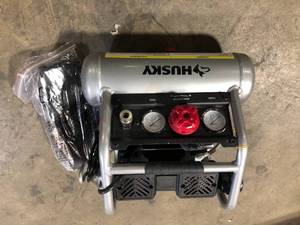 lot 7 image: Husky 1 Gal. Portable Electric-Powered Silent Air Compressor  Customer Returns See Pictures
