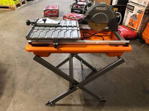 lot 9 image: RIDGID 9 Amp 7 in. Blade Corded Wet Tile Saw with Stand   Customer Returns See Pictures
