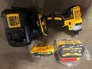 lot 10 image: DEWALT 20V MAX XR Cordless Brushless 3-Speed 14 in. Impact Driver with (1) 20V 2 Ah and 1 6ah Flexvolt  Battery and Charger  Customer Returns See Pictures