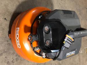 lot 18 image: RIDGID 6 Gal. Portable Electric Pancake Air Compressor  Customer Returns See Pictures