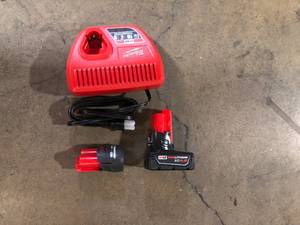 lot 50 image: Milwaukee M12 12-Volt Lithium-Ion High Output 5.0 Ah and 2.5 Ah Battery Packs and Charger Starter Kit  Customer Returns See Pictures
