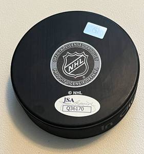 lot 307 image: Jordan Leopold Signed Minnesota Wild Hockey Puck with JSA COA